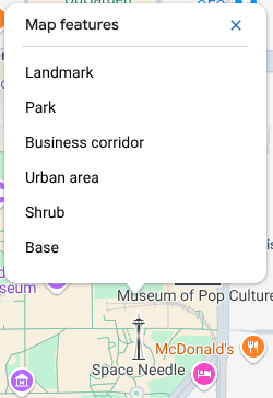 L&#39;inspecteur de carte s&#39;ouvre au-dessus de la Space Needle et liste six éléments de carte au point de clic : point de repère, parc, zone commerciale, zone urbaine, arbuste et base.