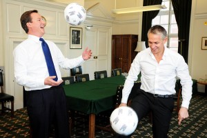 Leader of the Conservative Party David Cameron and sports broadcaster Gary Lineker practice their ball skills