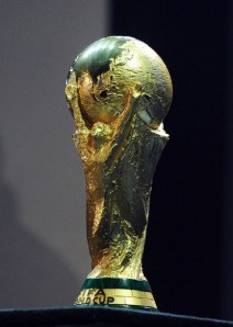 The FIFA World Cup trophy is displayed a