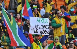 A football fan holds up a placard readin