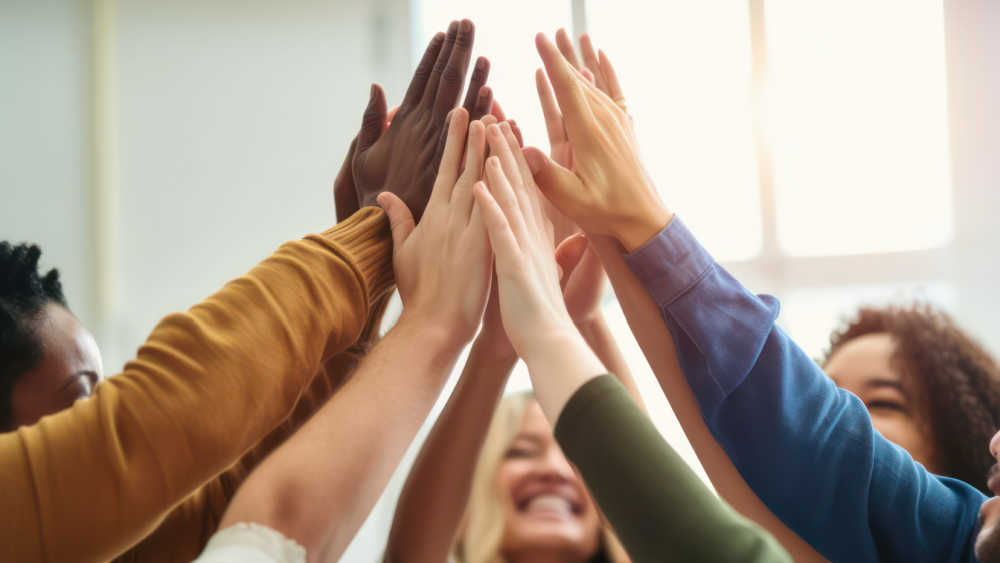 People giving each other high fives.