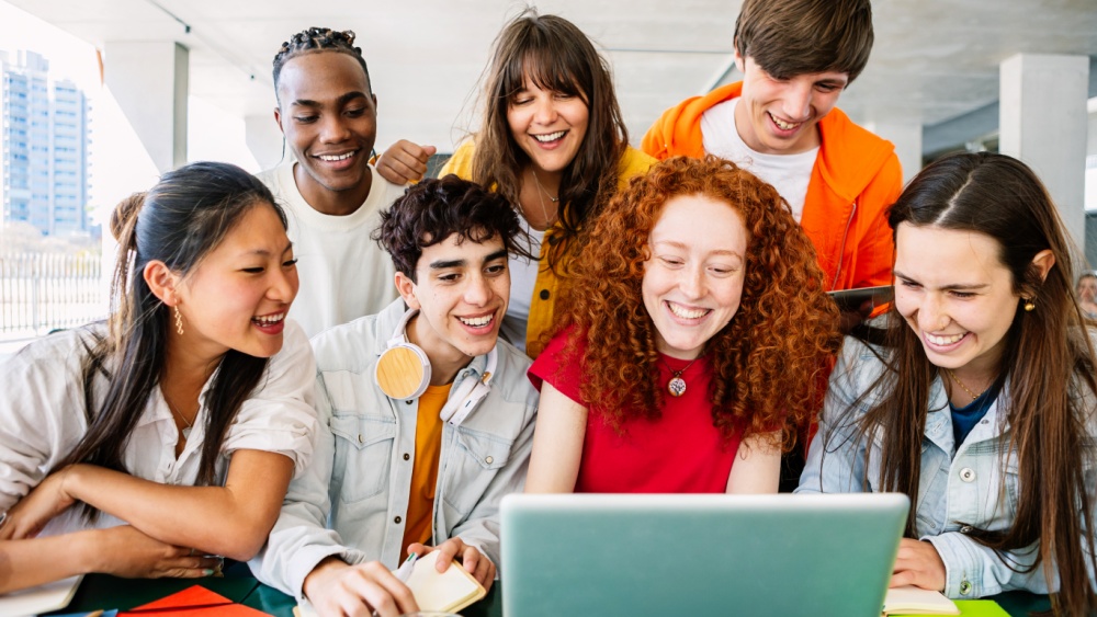 young people around a computer