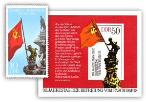 Two stamps of DDR showing the flag on German Parliament