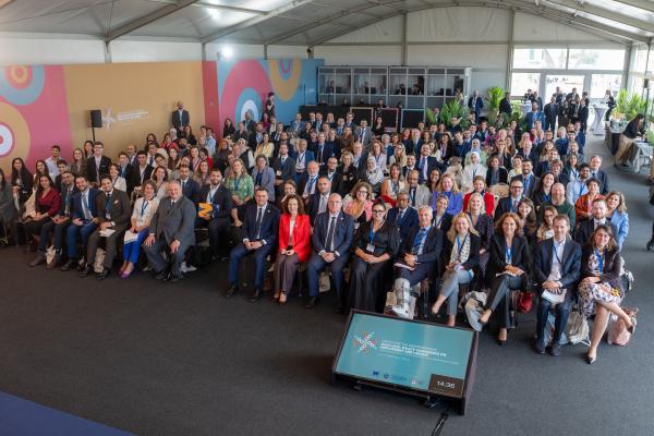 A group of people sitting at the Union for the Mediterranean event