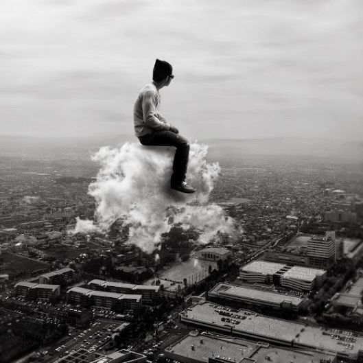 man-sitting-on-a-cloud