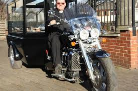 vicar on a motorbike