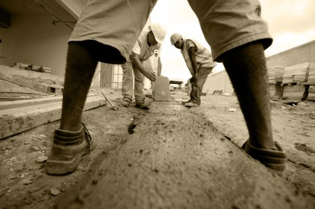 Construction, Luanda Angola Construction workers on a modern site in Angola, house rent in Angola is enough to buy a house without bank loan.