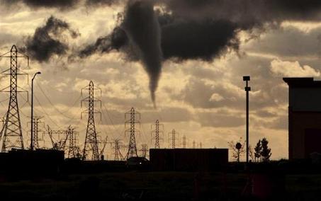 A tornado funnel approaches a residential area on the west side of Roseville