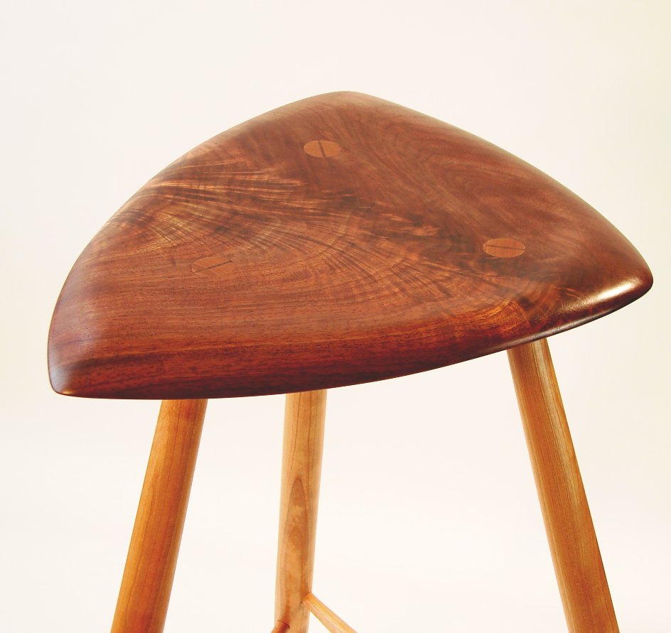 Sculpted walnut 3-legged stool