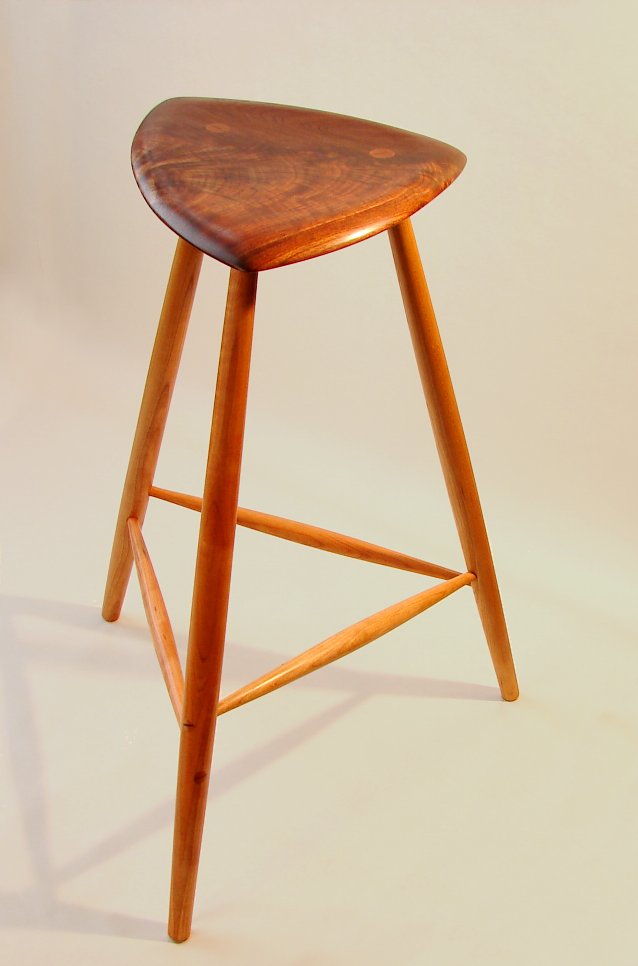Sculpted walnut 3-legged stool