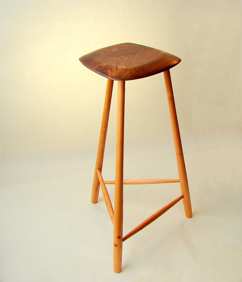Sculpted walnut 3 legged stool