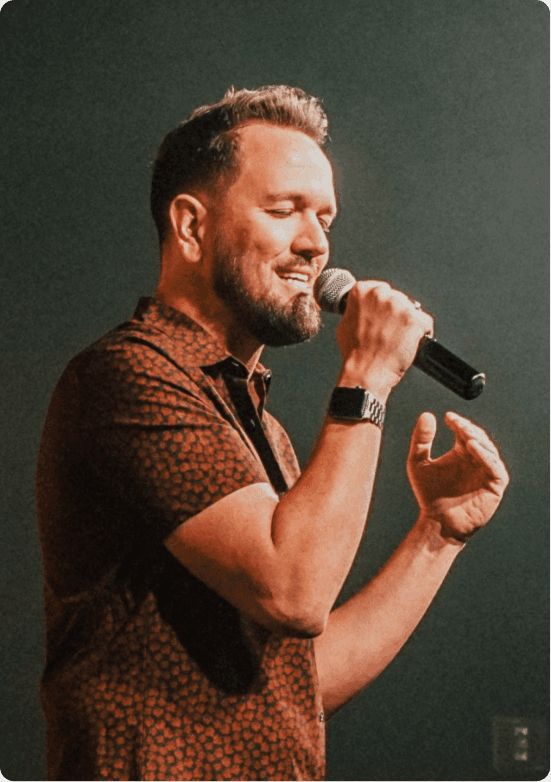 A worship leader sings a song.