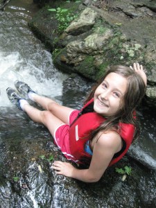 Ramsey at Waterfall Ramsey finds a seat in a riverside waterfall.