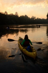 Jamie Rogers points her keyak into the sunrise as the Paddle Georgia Navy launches from Rocky Bend Flint River Retreat.