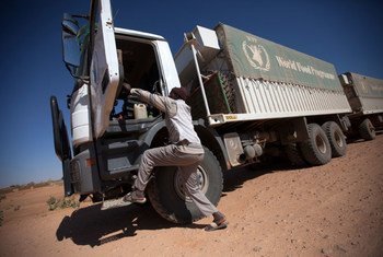 10 February 2014. El Fasher: A World Food Programme (WFP) truck driver on a trip from El Fasher to Shangil Tobaya, North Darfur. UN Photo/Albert Gonzalez Farran