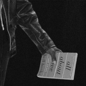 person holding a book titled all about love by bell hooks person holding a book titled all about love by bell hooks