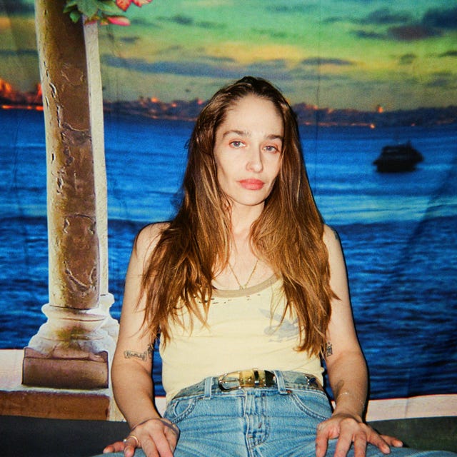 person sitting in front of a scenic backdrop person sitting in front of a scenic backdrop