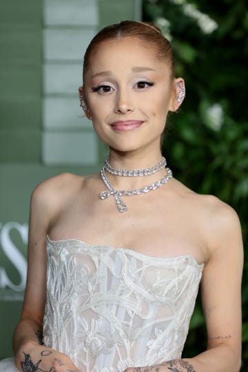 Ariana Grande in October2024 ariana grande smiles at the camera, she wears a strapless white gown and crystal jewelry
