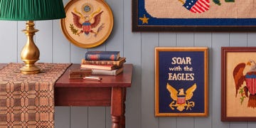 Decorative table with books lamp and wall art featuring eagles decorative table with books lamp and wall art featuring eagles