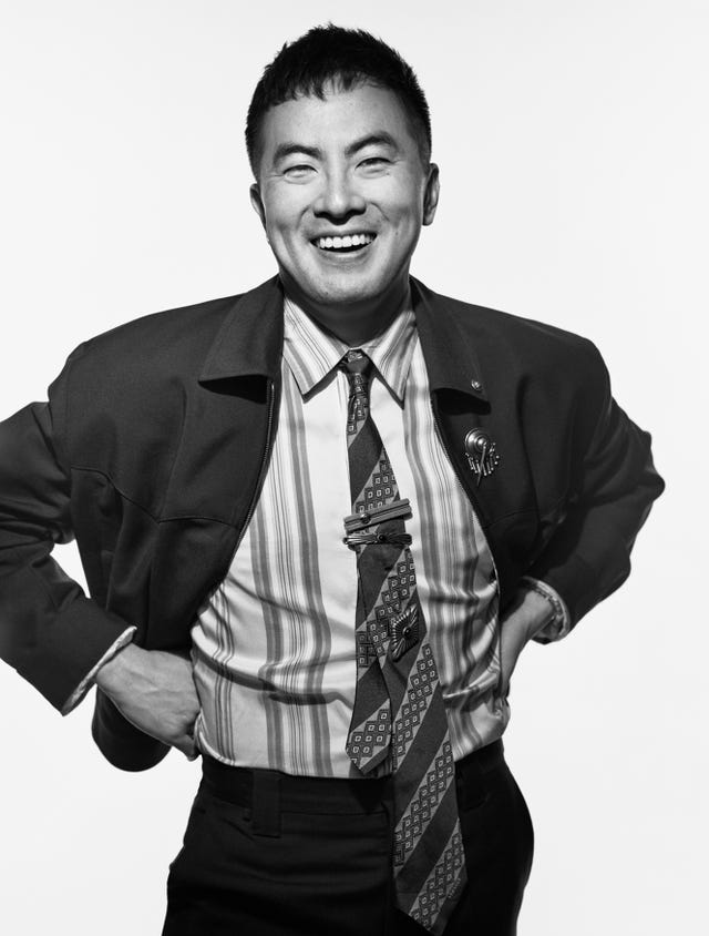 stylishly dressed individual with a patterned tie and blazer stylishly dressed individual with a patterned tie and blazer
