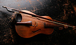 Philosophical Exploration Through the Expression of Vocal Music Low-key photograph of a violin.