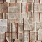 Reflecting on Urbanism in Latin America Between Empirical and Epistemological Contributions Photograph of open book pages spread out on a surface.