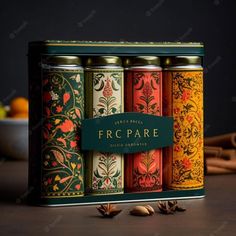 four cans of fruit and spice sit on a table