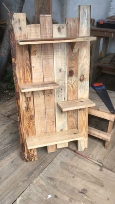 a wooden shelf sitting on top of a wooden floor