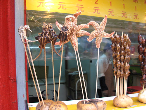 various meats on sticks