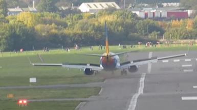 A Jet2 plane veering off the runway into the grass as it lands.