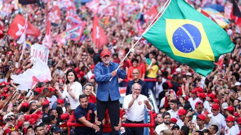 Luiz Inácio Lula Da Silva, incumbent president of Brazil and presidential candidate for Partido dos Trabalhadores (PT) waves a Brazil flag during a rally ahead of the presidential runoff at Avenida Paulista on October 24, 2026 in Sao Paulo, Brazil.