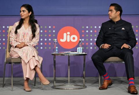 Isha Ambani, director at Jio Platforms (left) and Akash Ambani, managing director of Jio Platforms during a news conference ahead of the company's listing ceremony.