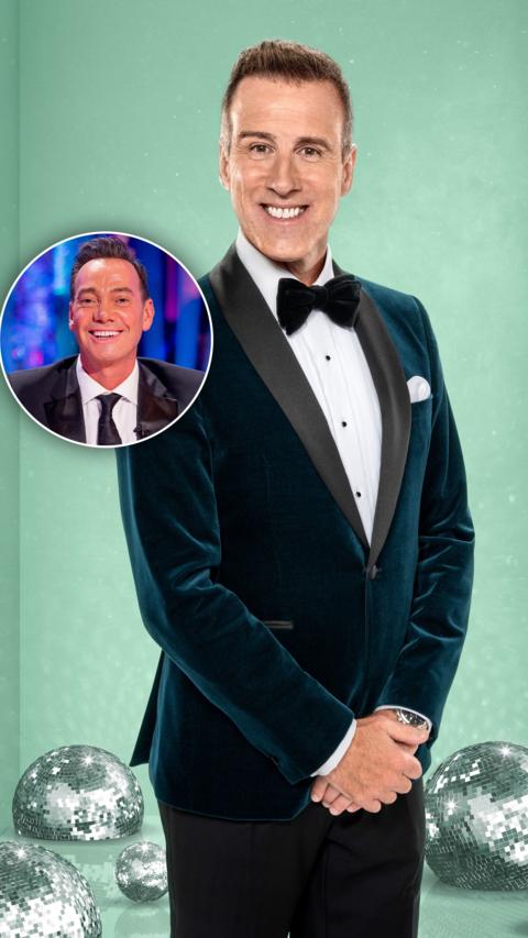 Anton Du Beke standing in a green suit