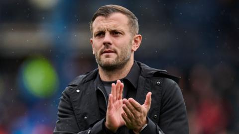 Luton Town boss Jack Wilshere applauding the fans after victory over Leicester City