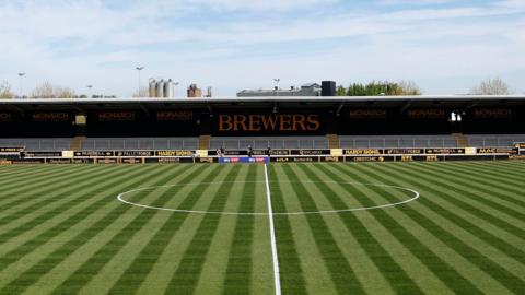 A view of the pitch at Burton Albion's Pirelli Stadium from the halfway line