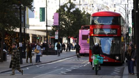 A bus is driving down a road