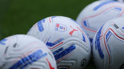 A group of EFL branded footballs