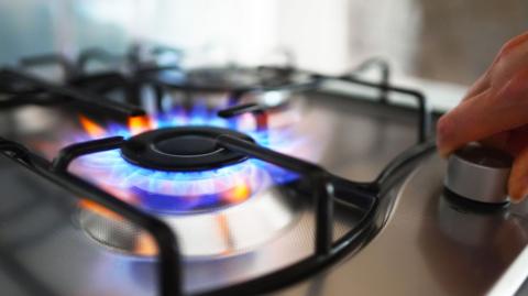 A close up shot of a lit ring on a gas hob