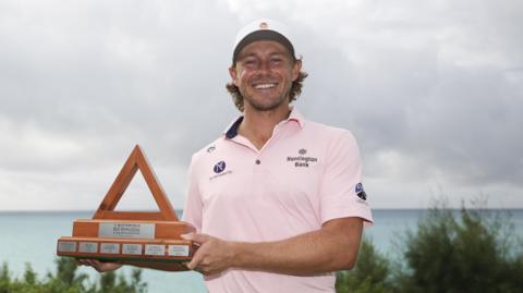 Austin Smotherman poses with the trophy