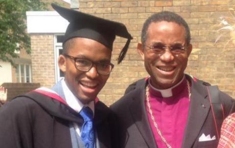 Eno Mwamba in a graduation cap next to his father Trevor Mwamba in cleric's robes