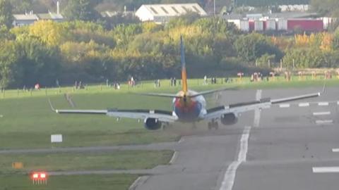 A Jet2 plane veering off the runway into the grass as it lands.