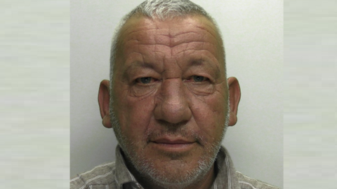 Eno Gajda custody photo. He has a tanned face, white stubble and short white hair.