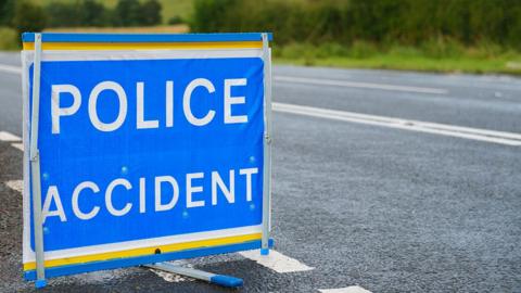Police accident sign in blue and white on a road