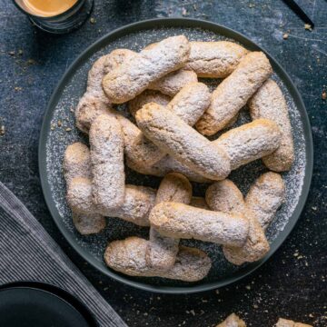 Vegan Ladyfingers served on a grey plate.