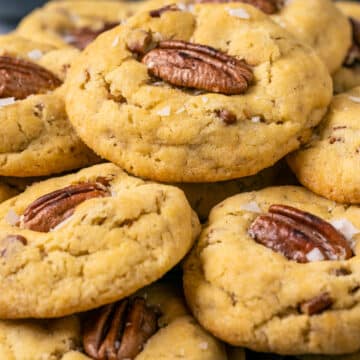 Stacked vegan butter pecan cookies.