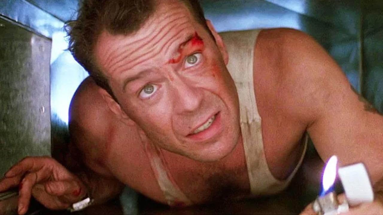 Bruce Willis and Taniel in Die Hard (1988)