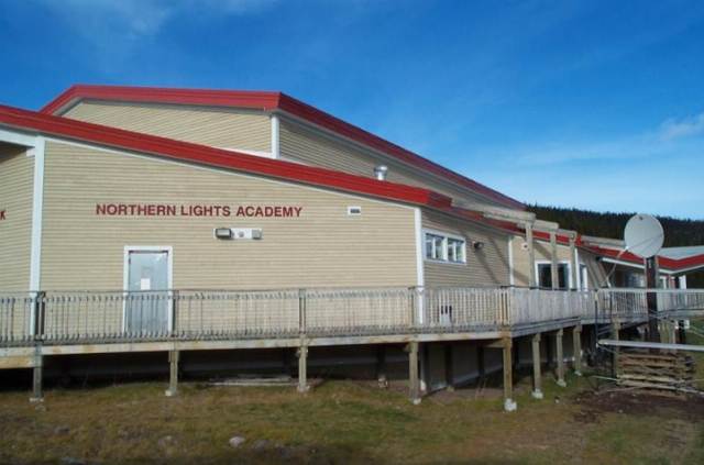 Northern Lights Academy, located in Rigolet Labrador is one of our sites. Note the satellite dish located off to the side. We've since replaced it with a land-based connection. The school is designed for northern climates. Note the raised boardwalk, for example. Far easier for clearing snow.