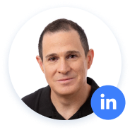 Man with LinkedIn icon on profile picture.