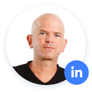 Bald man with a LinkedIn icon.
