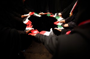 Female anti-government protesters display their hands during a demonstration demanding that relatives of Yemen's former president Ali Abdullah Saleh be dismissed from senior army and police posts in Sanaa